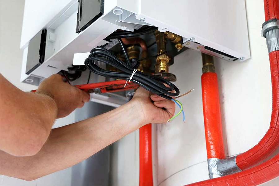man repairing heating system